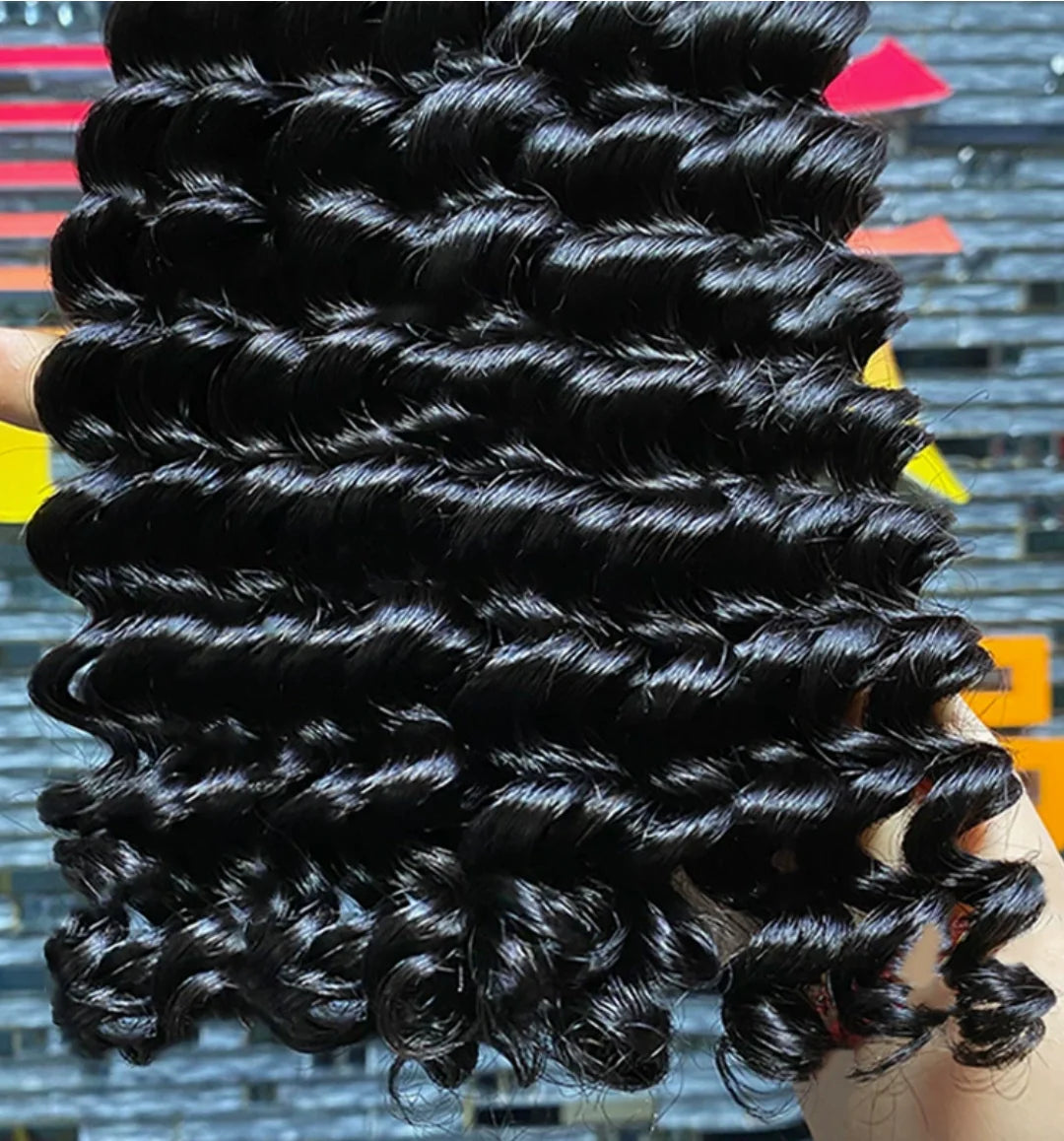 Aurasilk deep wave bundle extensions in Brazilian Remy human hair with machine double weft and a natural color
