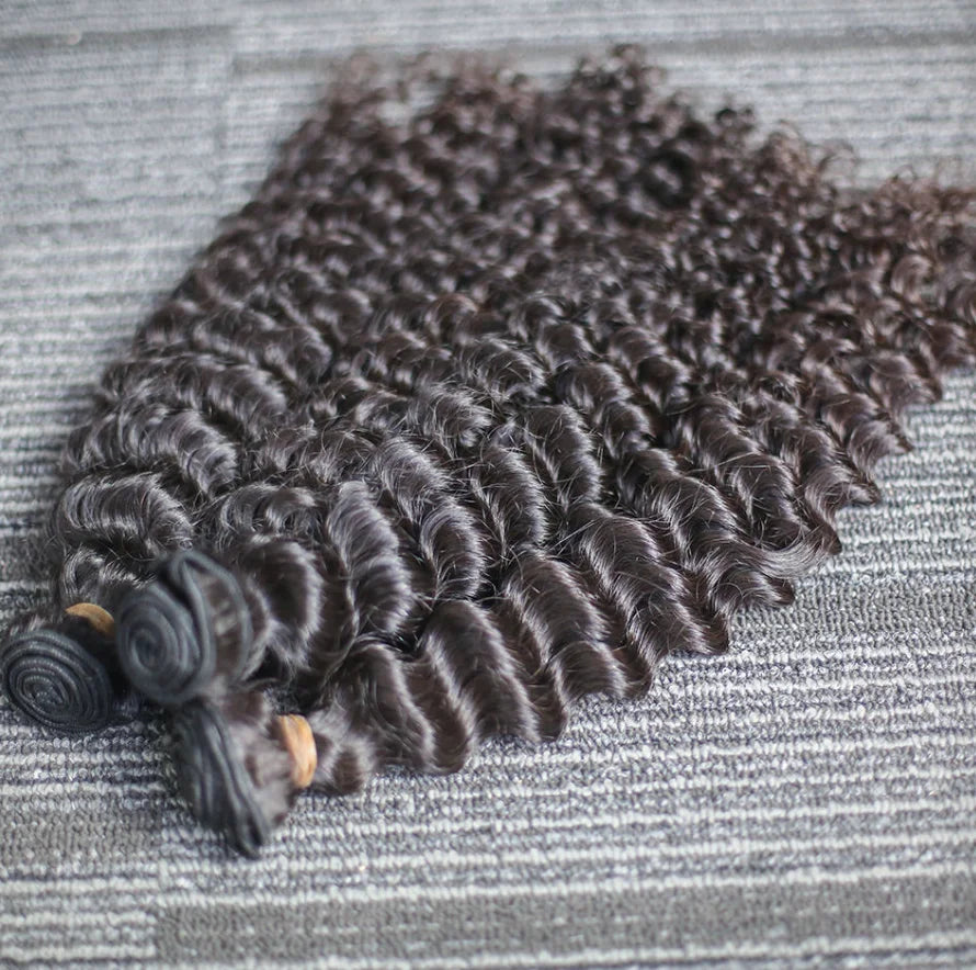 Aurasilk deep wave bundle extensions in Brazilian Remy human hair with machine double weft and a natural color