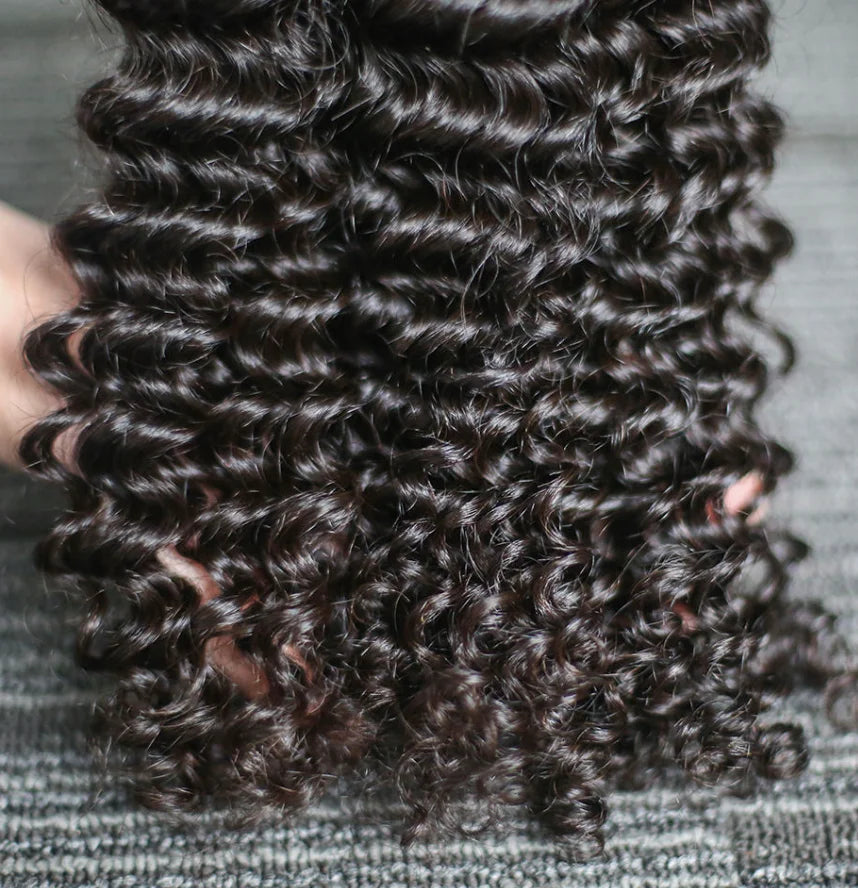 Aurasilk deep wave bundle extensions in Brazilian Remy human hair with machine double weft and a natural color